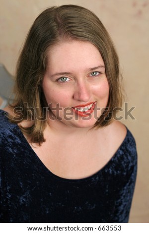 A beautiful high school senior posing for her senior portrait.