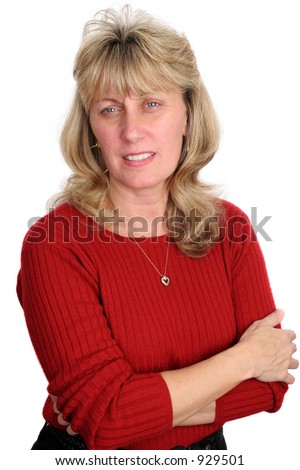 stock photo A pretty mature blond woman with her arms crossed