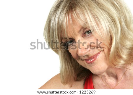 stock photo A closeup of a beautiful mature blond woman smiling