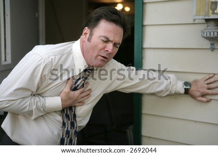 A middle aged man experiencing sudden chest pain.