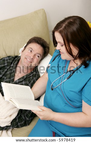 Caring home health nurse reading to a patient.  Focus on him.