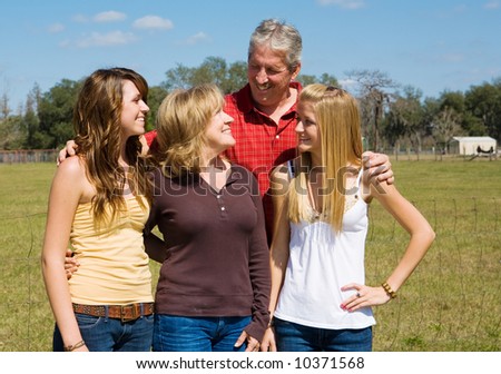 Beautiful teen girls enjoying a visit on the farm with their attractive grandparents.