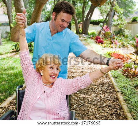 Senior woman enjoys working out with physical therapist.
