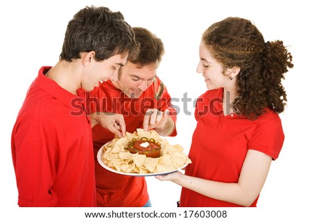 Waitress serving appetizers at a football party.  Isolated on white.