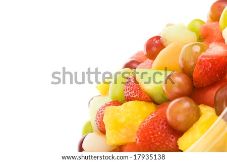 Fresh chopped fruit salad, isolated on white with copyspace.