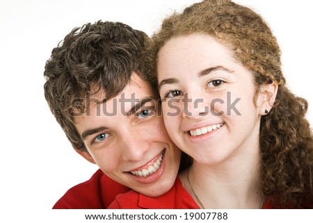 stock photo Closeup portrait of cute teen boy and girl with perfect teeth 
