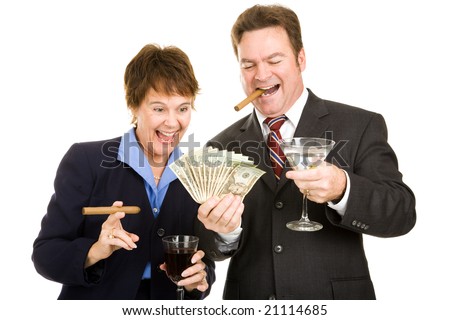 Business partners holding a wad of cash while smoking cigars and drinking cocktails.  Isolated. - stock photo