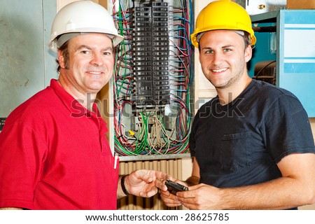 journeyman electrician. electrician and apprentice
