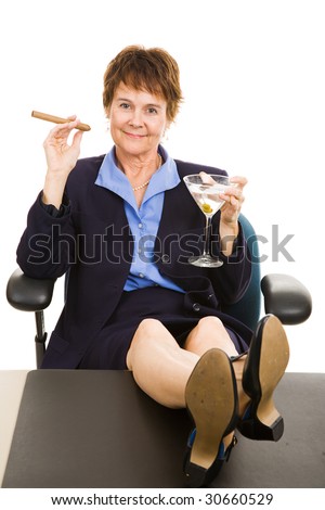 stock photo Mature businesswoman celebrates success with her feet on her 