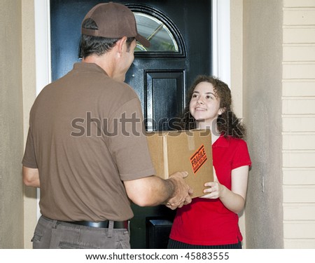 Teen girl receives package from friendly delivery man.