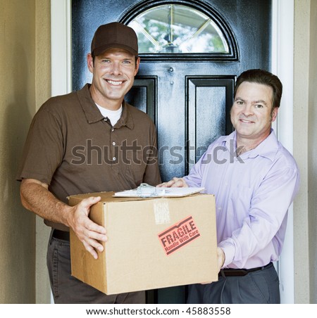 Delivery man hands package to satisfied customer.