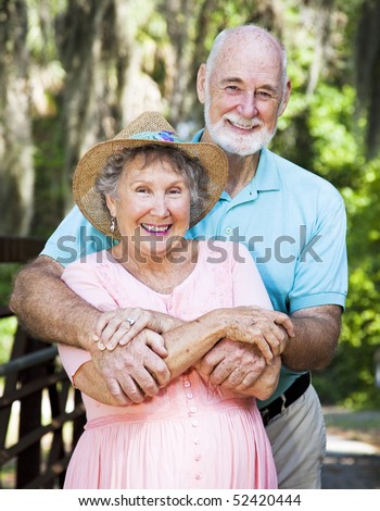 Portrait of beautiful senior couple in natural outdoor setting.
