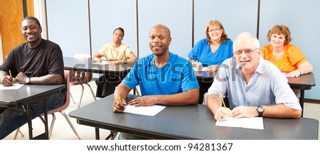 Diverse adult education or college class.  Wide angle banner.