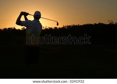 Golfer silhouette on golden sunset with black copy space
