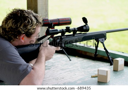 Guy with Steyr SSG PII Sniper Rifle at shooting range
