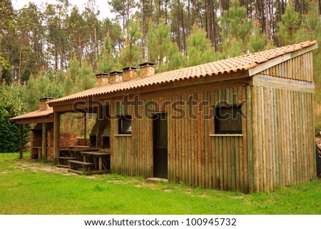 Modern wooden storage house against woods
