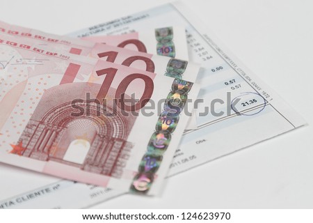 Bill to pay with some euro banknotes above
