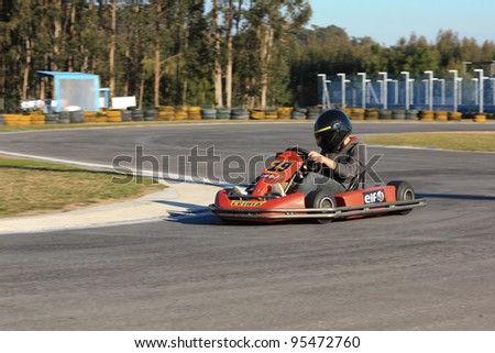 LEIRIA, PORTUGAL - JANUARY 28: An unknown driver/team participating in Old Motor Club Of Marinha Grande Karting Race, organized by Motor Club Of Marinha Grande, in Leiria, Portugal on January 28, 2012.