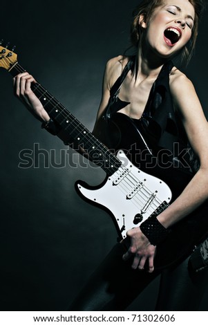 Fashion girl with guitar playing hard-rock!