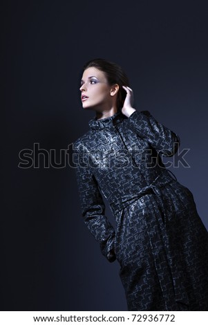 Portrait of young sexy glamorous woman have a black clothing on black background