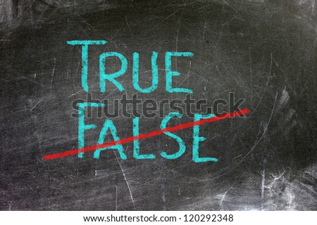 True or false written on a blackboard with white chalk.
