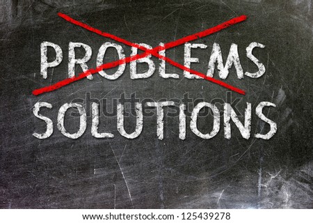 Problems Solutions handwritten with white chalk on a blackboard.
