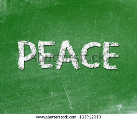 The word peace written on a blackboard