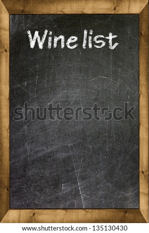 Wine list written with white chalk on a blackboard