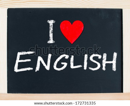 The word I Love English handwritten in white chalk on a used blackboard