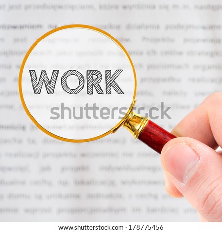 Work. Hand, holding classic styled magnifying glass with word Work