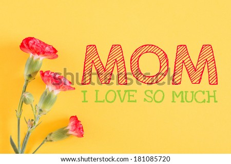 Carnation and paper with text Happy mother day,I love you so much MOM on yellow background