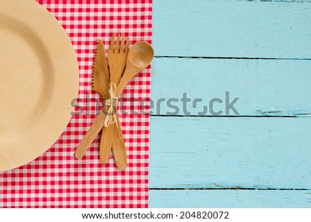 Menu template,empty plate on blue wooden background