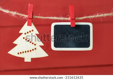 Old pictures on wood background with Christmas decoration.Wooden christmas tree hanging with old picture on rope