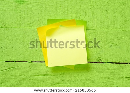 Ã?Â Sticky notes isolated on wooden background with clipping path. Above view.