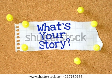 The phrase What\'s Your Story typed on a piece of lined paper pinned to a cork notice board