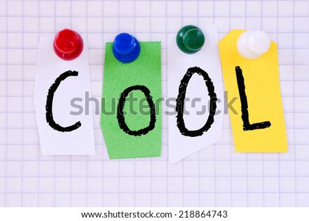 The word Cool in cut out magazine letters pinned paper sheet