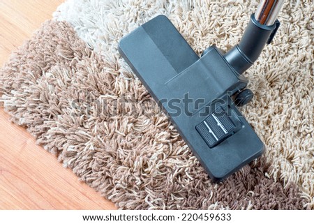 Vacuuming very dirty white carpet with cleaner