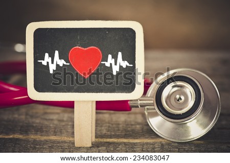 Heartbeat and stethoscope. Medecine concept. Blackboard with Heartbeat and stethoscope