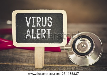 Virus alert and stethoscope. Medecine concept. Blackboard with word virus alert and stethoscope