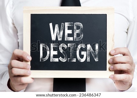 Web design background . Idea. Businessman holding board on the background with web design words