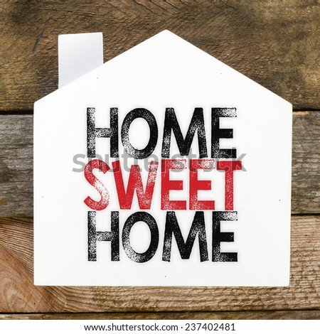 Home sweet home sign on rustic wood