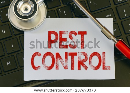 Pest control sign and stethoscope. Pest control sign and stethoscope. Medicine concept on computer keyboards