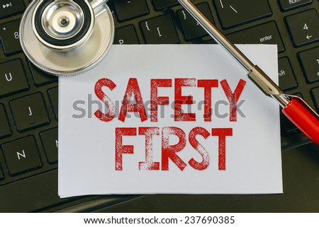 Safety first sign and stethoscope.Safety first sign and stethoscope. Medicine concept on computer keyboards
