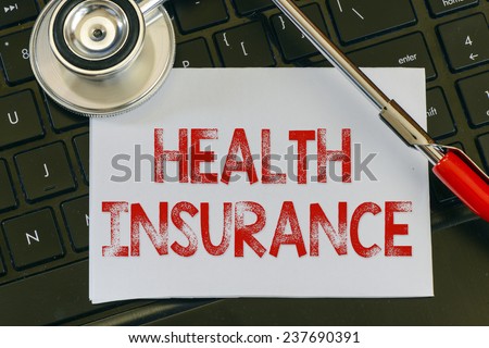 Health insurance sign. Health insurance sign and stethoscope. Medicine concept on computer keyboards