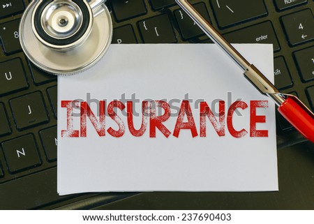 Insurance sign and stethoscope. Insurance sign and stethoscope. Medicine concept on computer keyboards