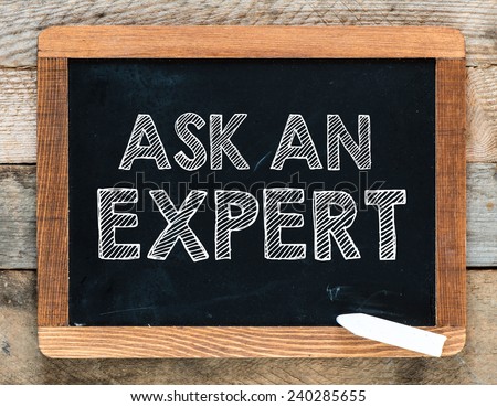 Ask an expert background. Ask an expert handwritten with white chalk on a blackboard
