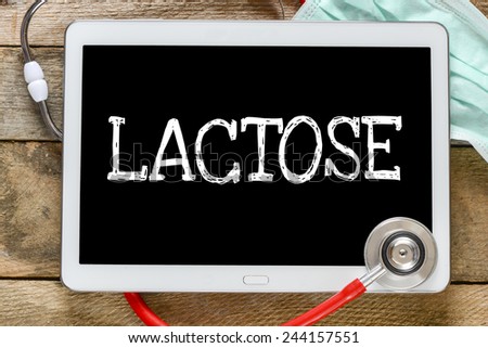 Tablet pc with word Lactose. Tablet pc with word Lactose and stethoscope, medicine concept