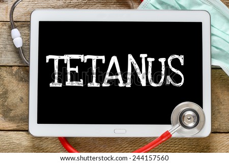 Tablet pc with word Tetanus. Tablet pc with word Tetanus and stethoscope, medicine concept