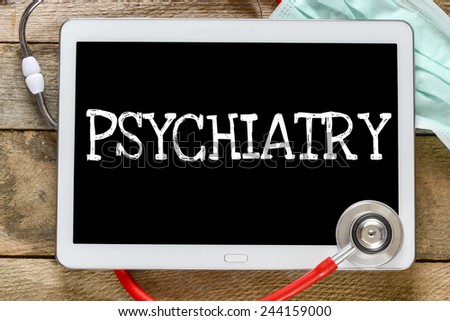 Tablet pc with word Psychiatry. Tablet pc with word Psychiatry and stethoscope, medicine concept