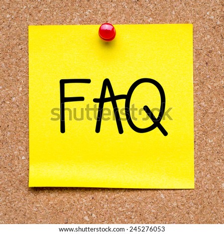 Yellow note with FAQ. Blank yellow sticky note with FAQ pined on a cork bulletin board.